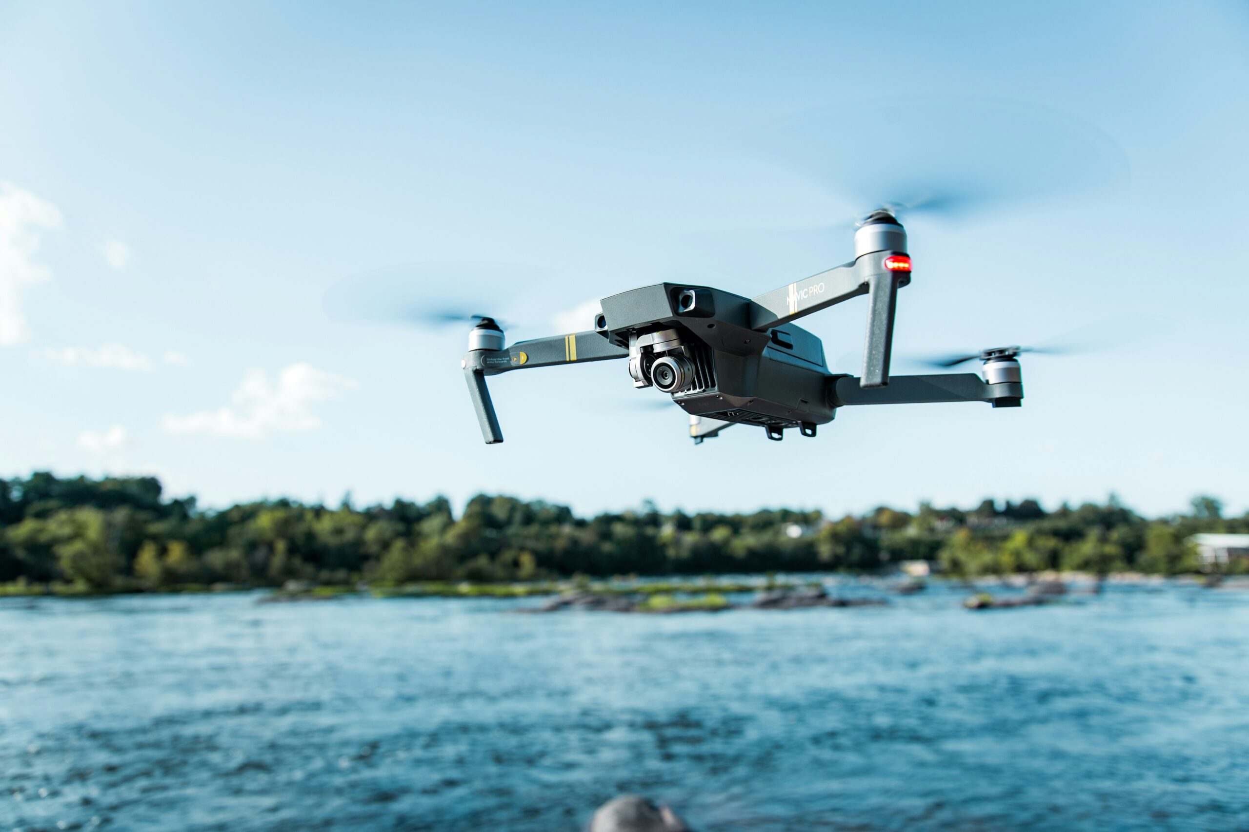 A drone flying over a large body of water